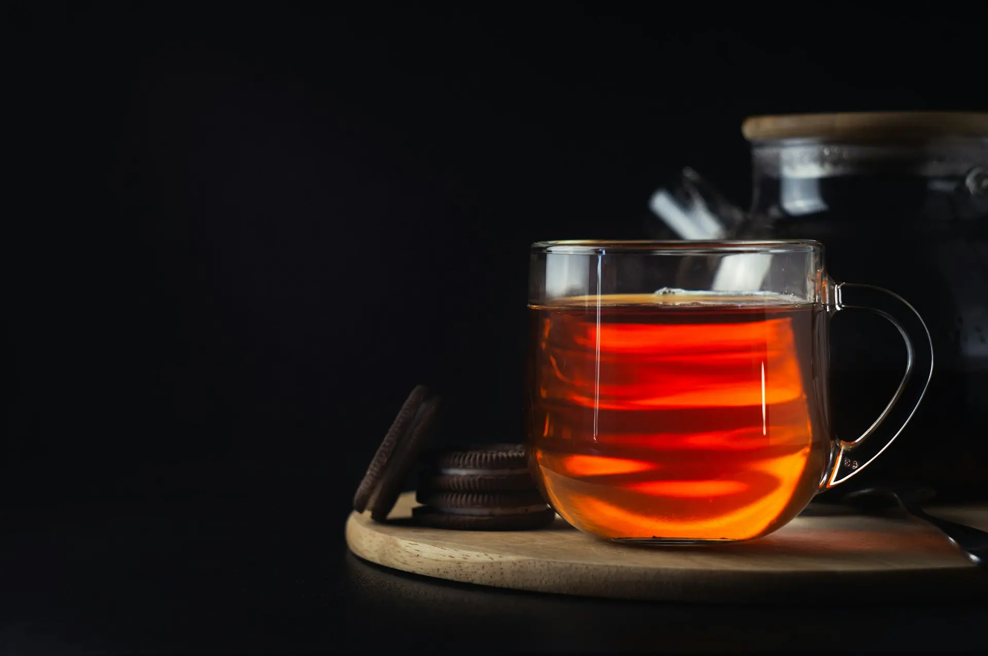 clear drinking glass with orange liquid inside